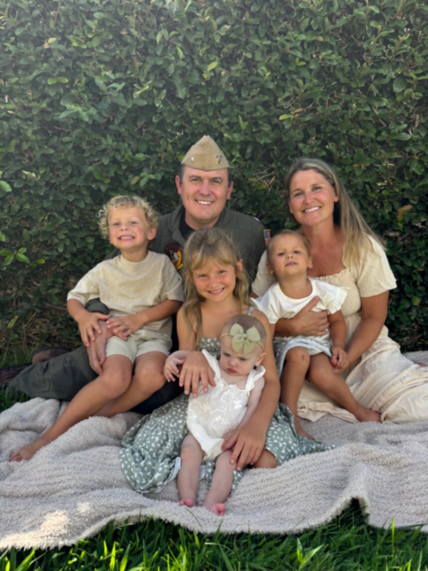 The Holian family together outdoors